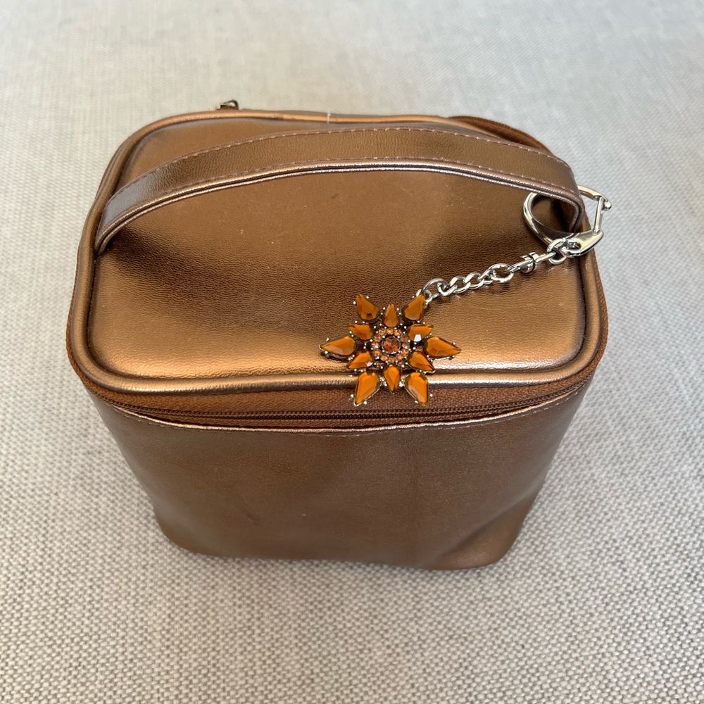 Bath & BodyWorks bronze make up bag